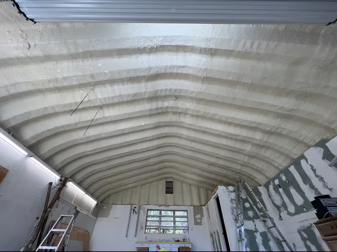 Spray polyurethane foam applied to the underside of a metal roof deck in Alachua